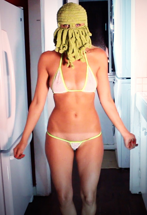 Brooke Marks is wearing a bikini and a Cthulhu mask